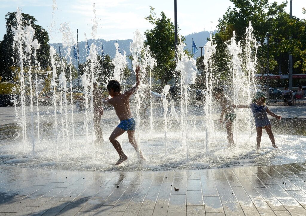 children playing, water fountain, zurich-2213748.jpg